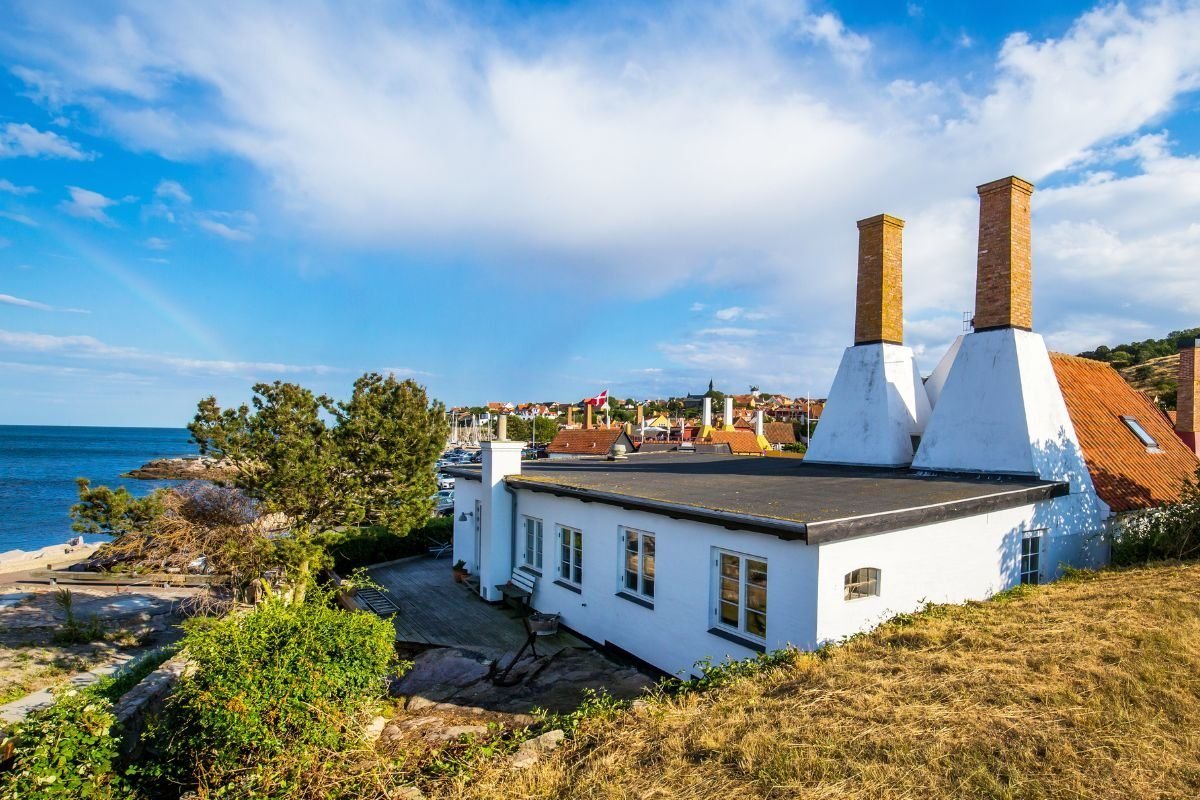A smokehouse (røgeri) with white chimneys on Bornholm