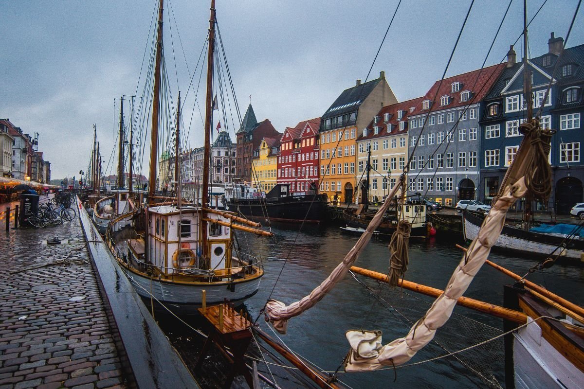 Old sailing ships and coloured houses along Nyhavn in Copenhagen