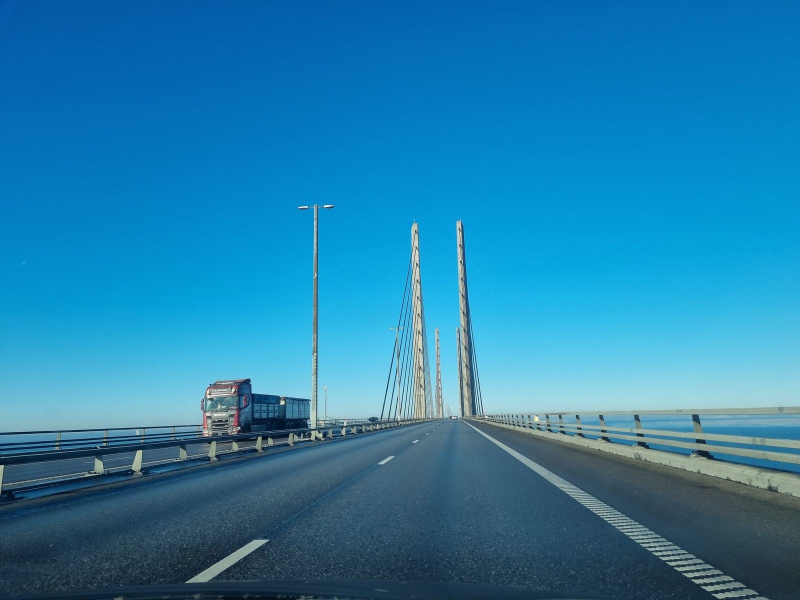 A lorry on the Øresund Bridge, with the cable-stayed section and its pylons straight ahead