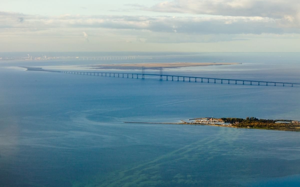 Aerial view of the Øresund Bridge reaching the artificial island of Peberholm